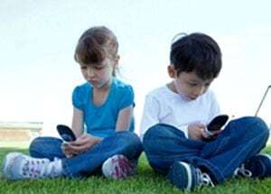 kidson mobile phones with heads down typical tech neck posture