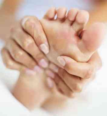 lady holding foot in pain