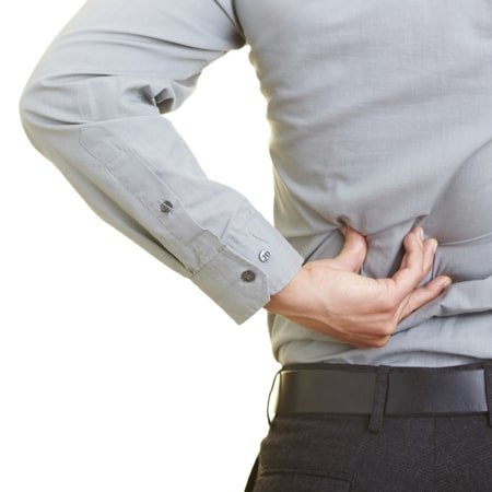 man holding back in pain